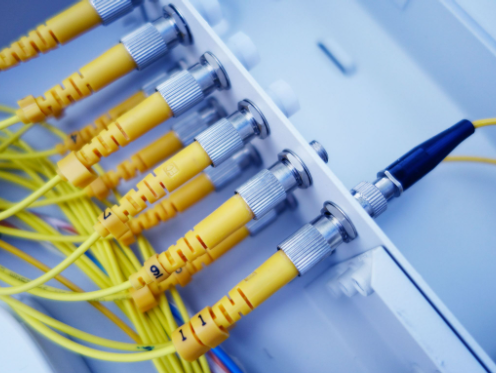 Certified telecommunications tech installing high-speed backbone architecture via Fibre Optic Services in Sterling VA by 1BTC.